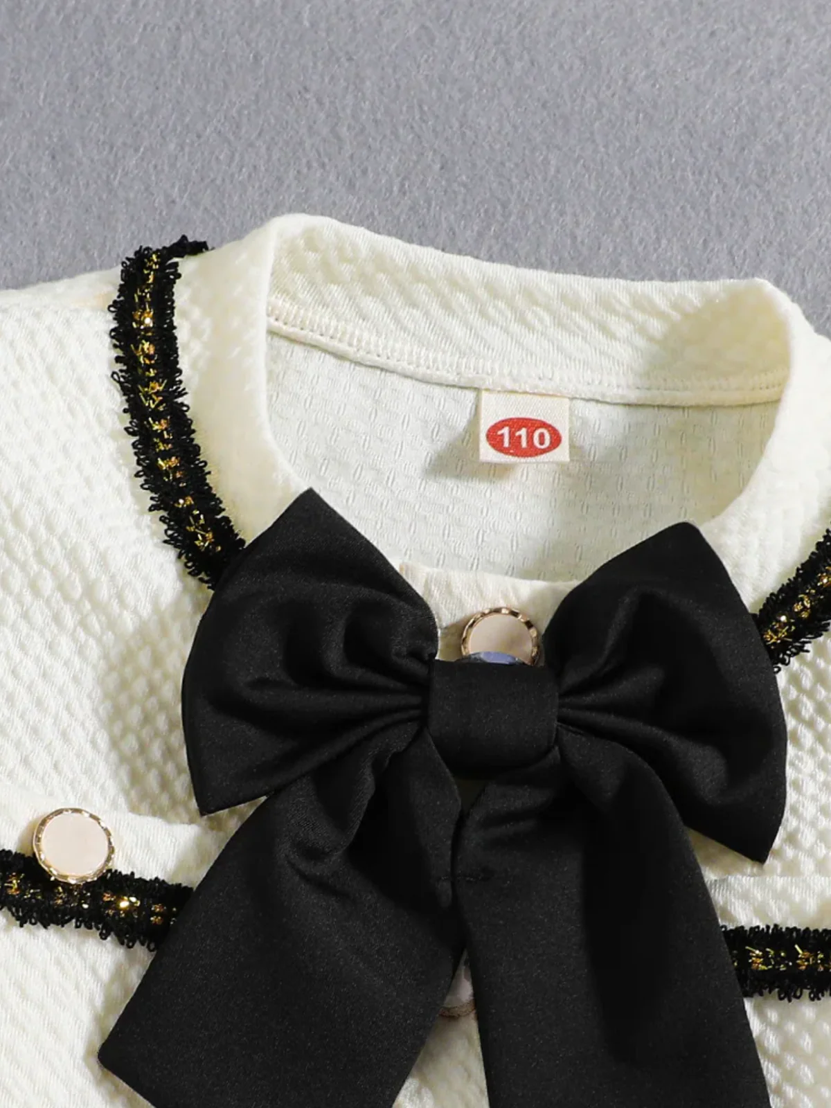 Elegant Cream Girls' Jacket and Pants Set with Black Bow Accent - Image 3