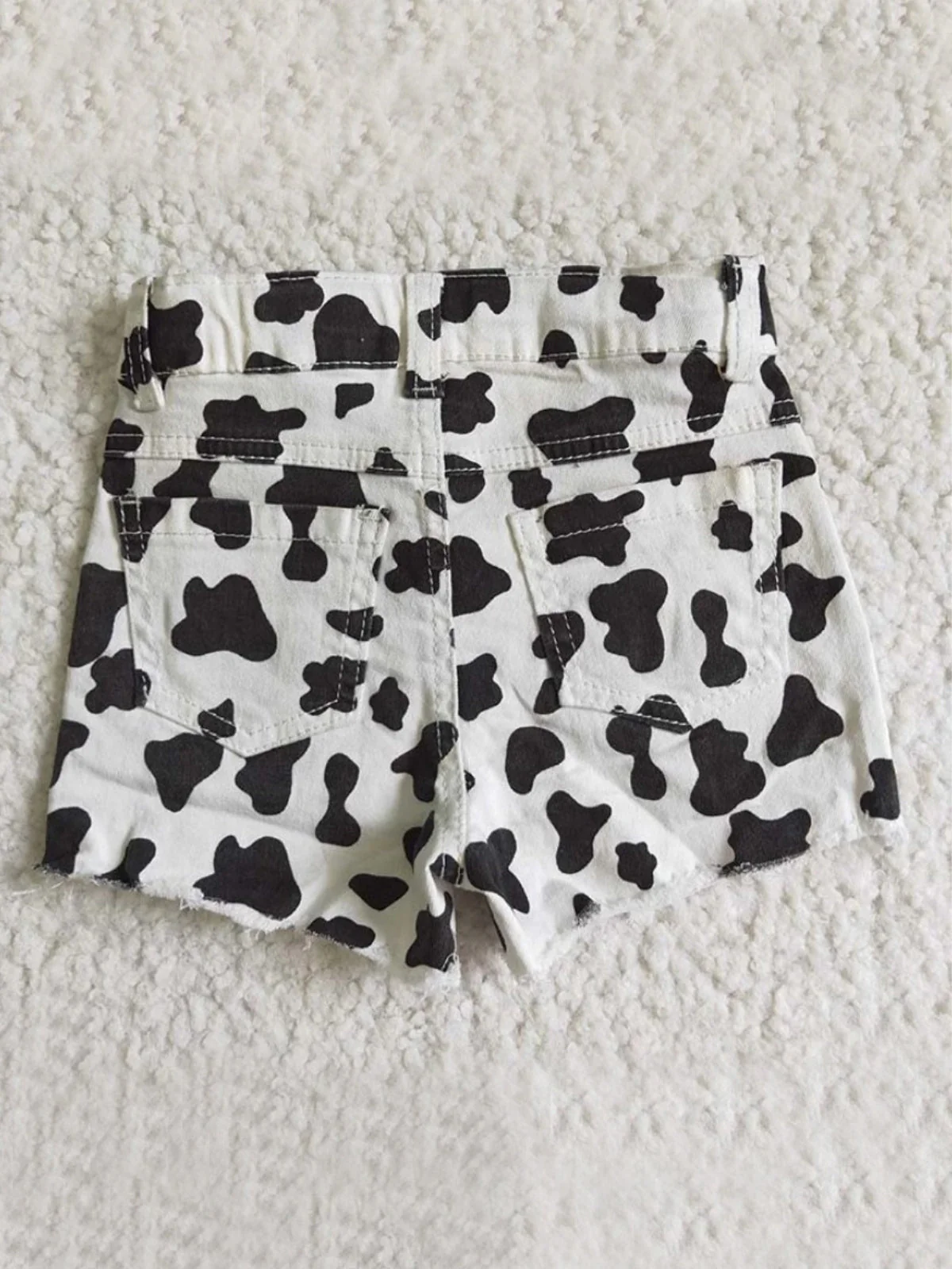 Wild Child Cow Print Distressed Shorts - Image 2